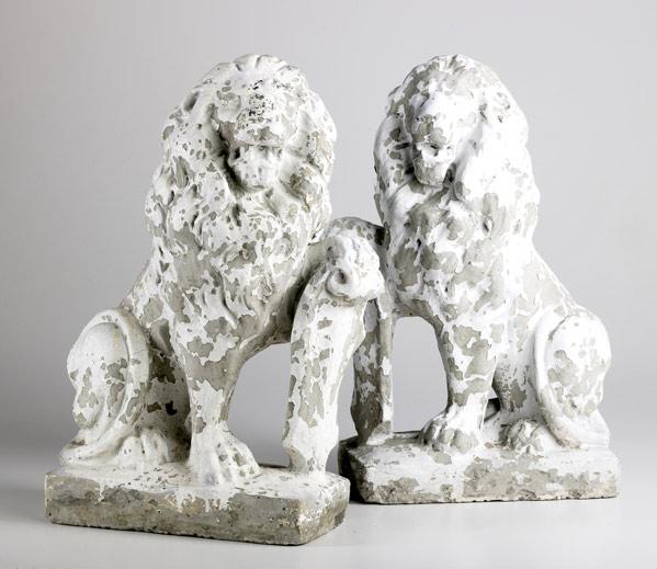 Appraisal: CONCRETE LIONS Pair of well weathered lion figures from a