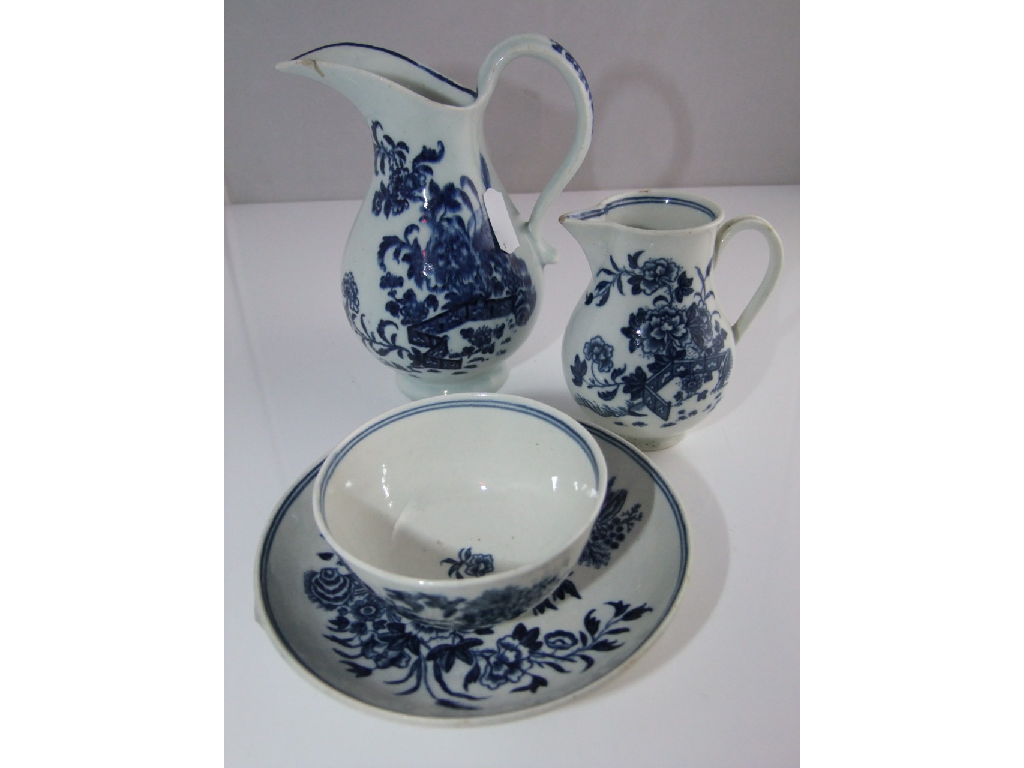 Appraisal: Two th century Caughley jugs both with chinoiserie blue printed