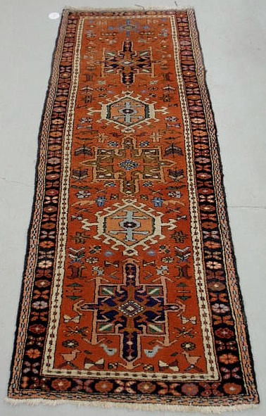 Appraisal: Heriz oriental hall runner with five geometric medallions orange field