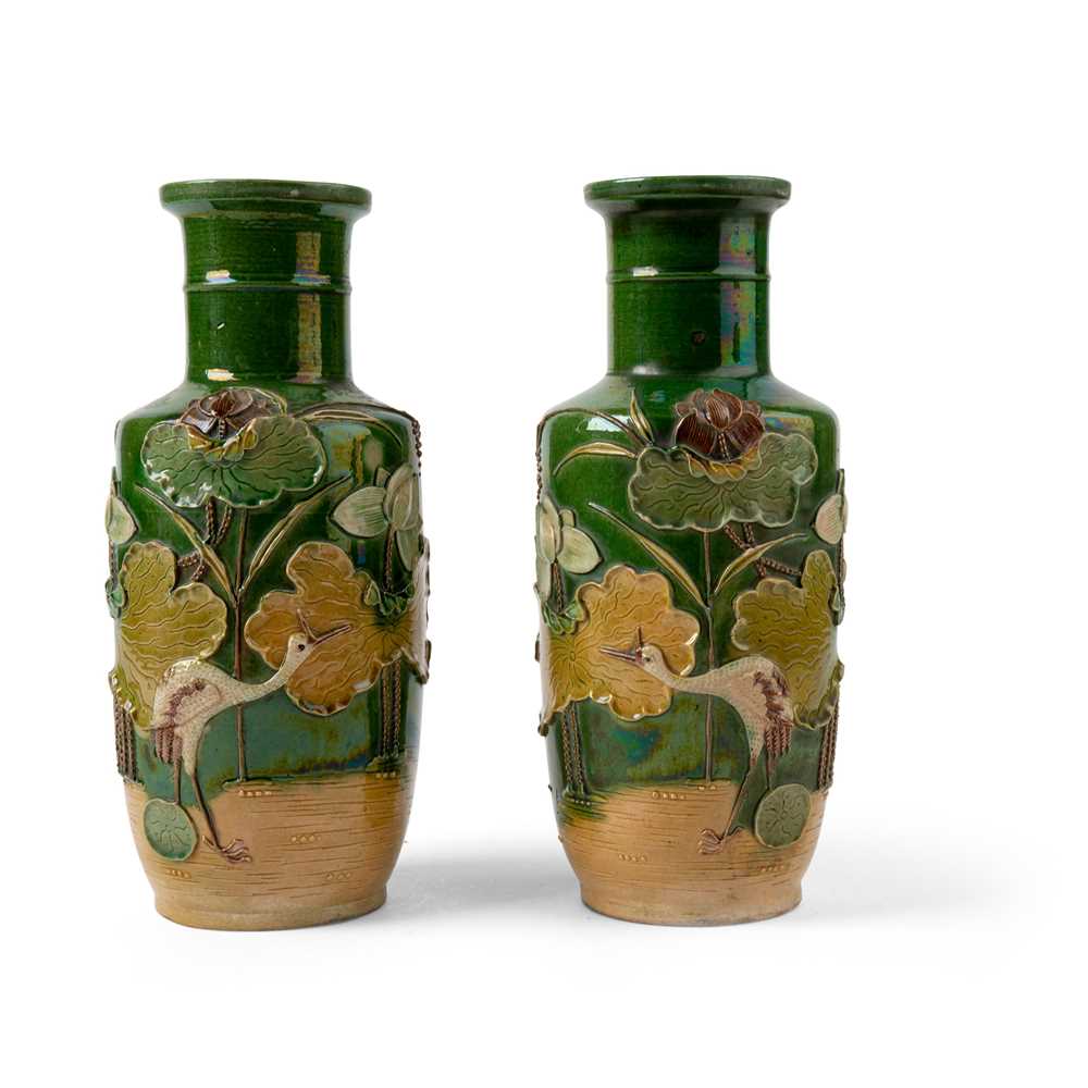 Appraisal: PAIR OF SANCAI CARVED BISCUIT 'CRANE AND LOTUS POND' VASES