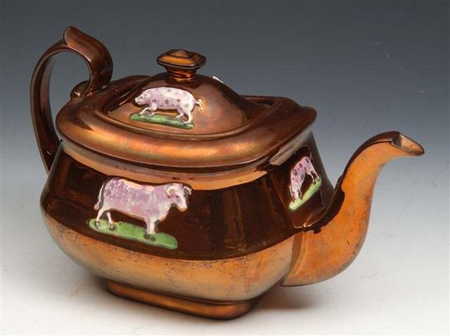 Appraisal: A VICTORIAN COPPER LUSTRE TEAPOT with raised relief decoration of