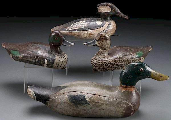 Appraisal: FOUR CARVED AND PAINTED DUCK DECOYS FOUR CARVED AND PAINTED