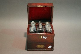 Appraisal: A Victorian medicine cabinet with original bottle and a phial