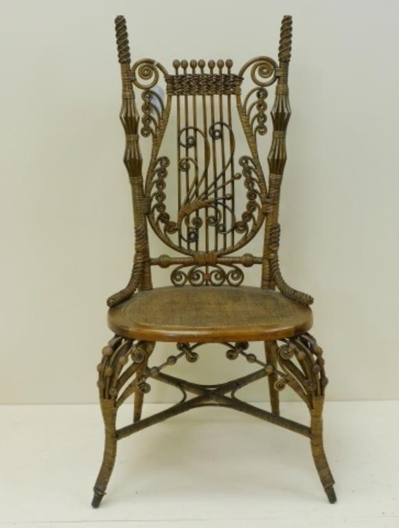 Appraisal: lyre shaped back Rattan with maple frame Beaded birdcage design