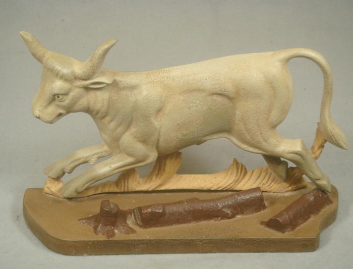 Appraisal: Cast iron doorstop large tan bull on brown base with