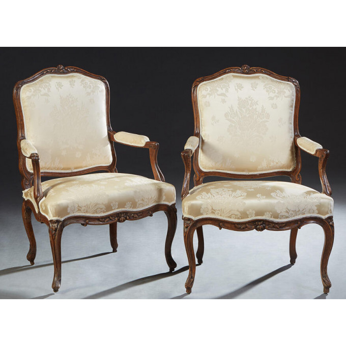 Appraisal: Pair of French Louis XV Style Carved Cherry Fauteuils late