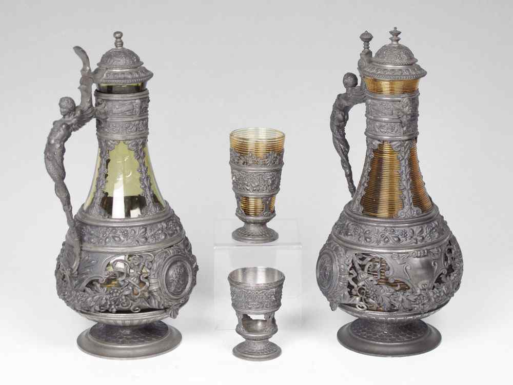 Appraisal: PIECE PEWTER OVERLAY FIGURAL WINE DECANTERS Similar but not identical