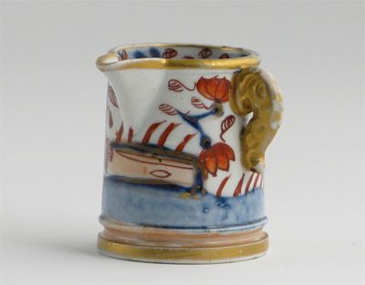 Appraisal: A miniature Mason's side-handled jug painted with flowers and fences