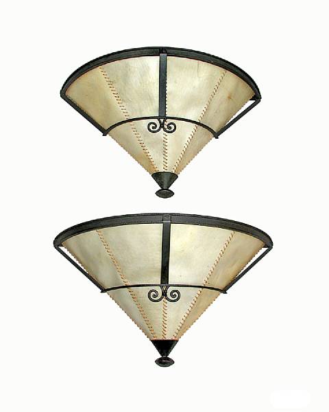 Appraisal: A pair of French patinated wrought iron wall lights circa