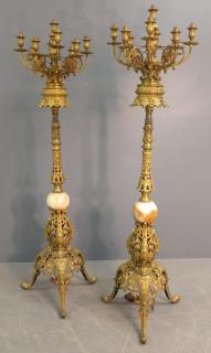 Appraisal: Standing brass torche Pair of standing brass nine-light electrified torches