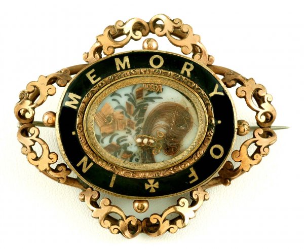 Appraisal: Victorian mourning brooch Oval goldfilled frame with reticulated scroll border