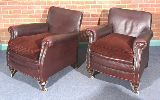 Appraisal: A PAIR OF OLD LEATHER CLUB ARMCHAIRS brass studded on