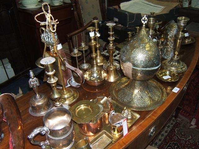 Appraisal: A large collection of antique metal ware to include candlesticks