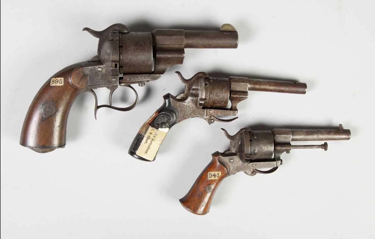 Appraisal: Pistols Top to bottom French revolver shot cal pinfire Foreign