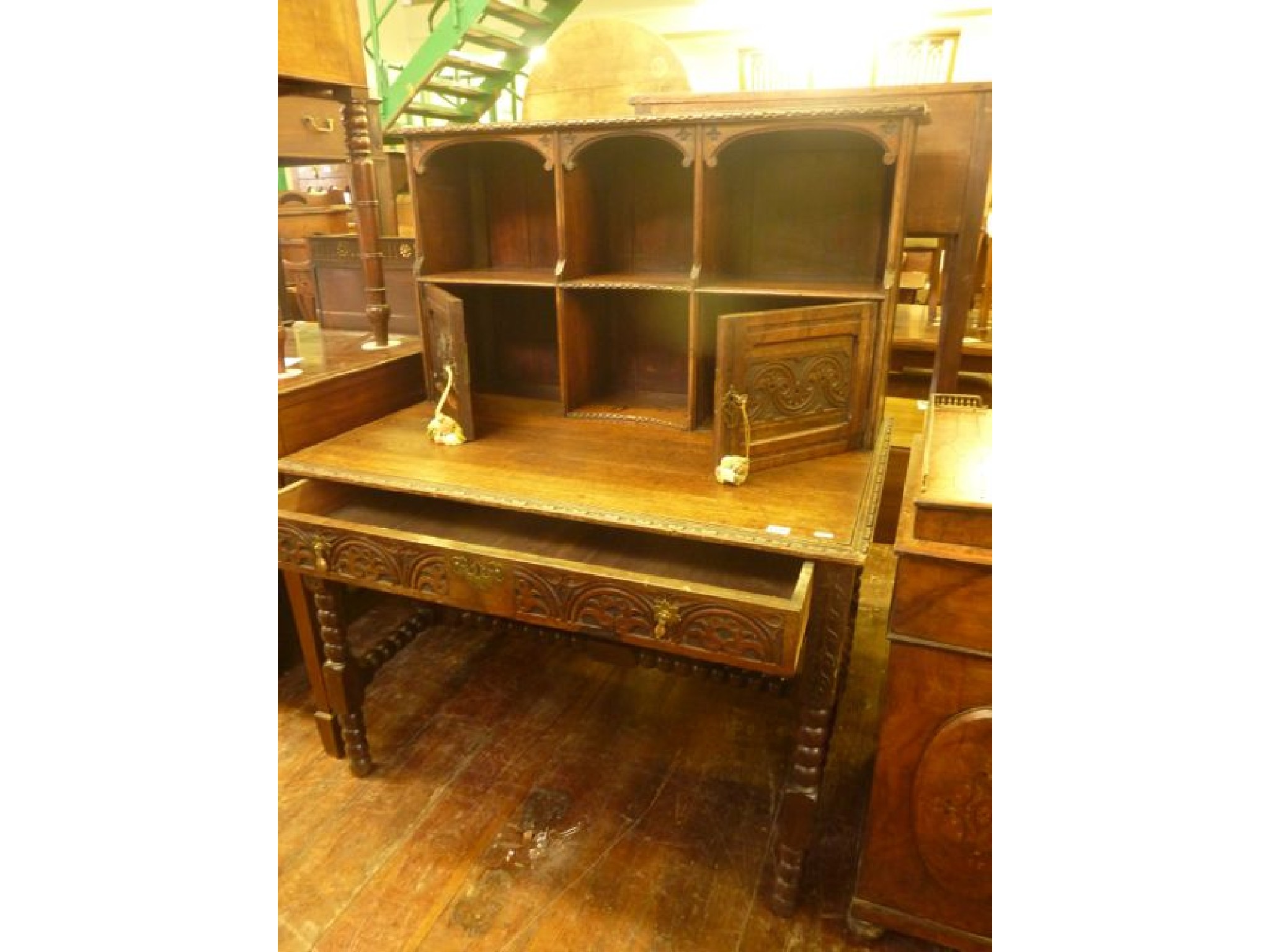 Appraisal: A Victorian carved oak desk of rectangular form with raised