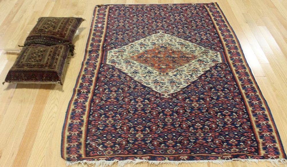 Appraisal: Antique and Finely Hand Woven Carpet Together With a Saddle