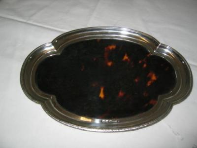 Appraisal: A TORTOISESHELL BRUSH TRAY of lobed oval form with moulded