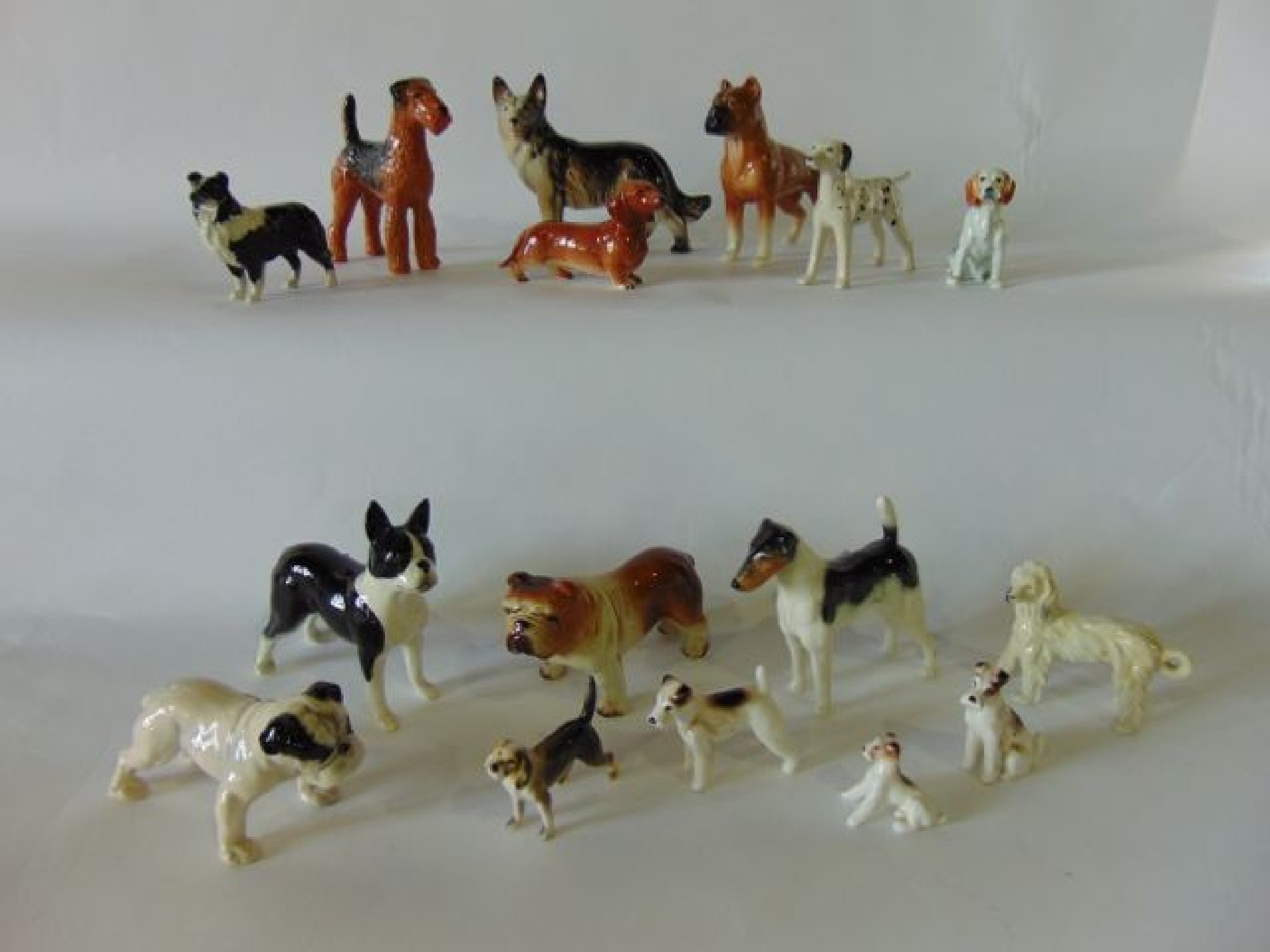 Appraisal: A quantity of various ceramic dogs including Sylvac models of