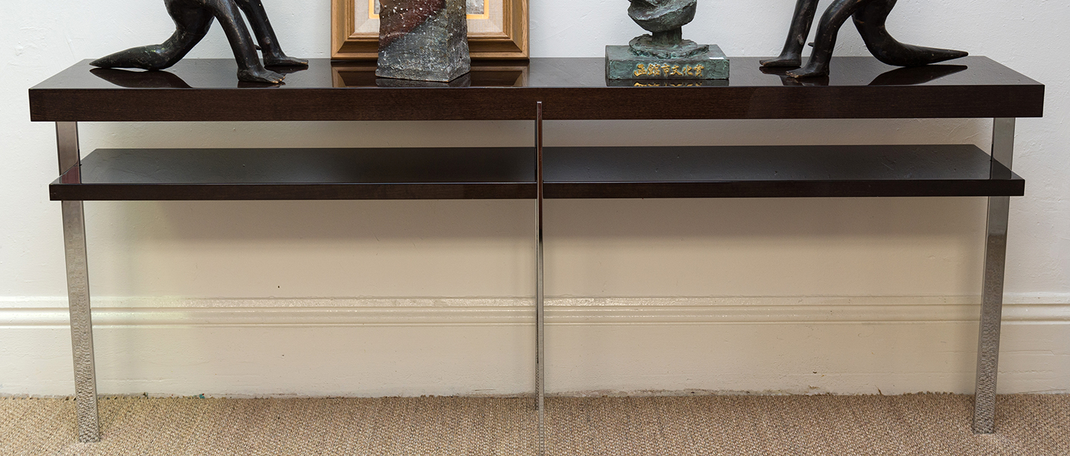 Appraisal: A 'MALERBA' CONTEMPORARY TWO TIERED CONSOLE TABLE WITH A POLISHED