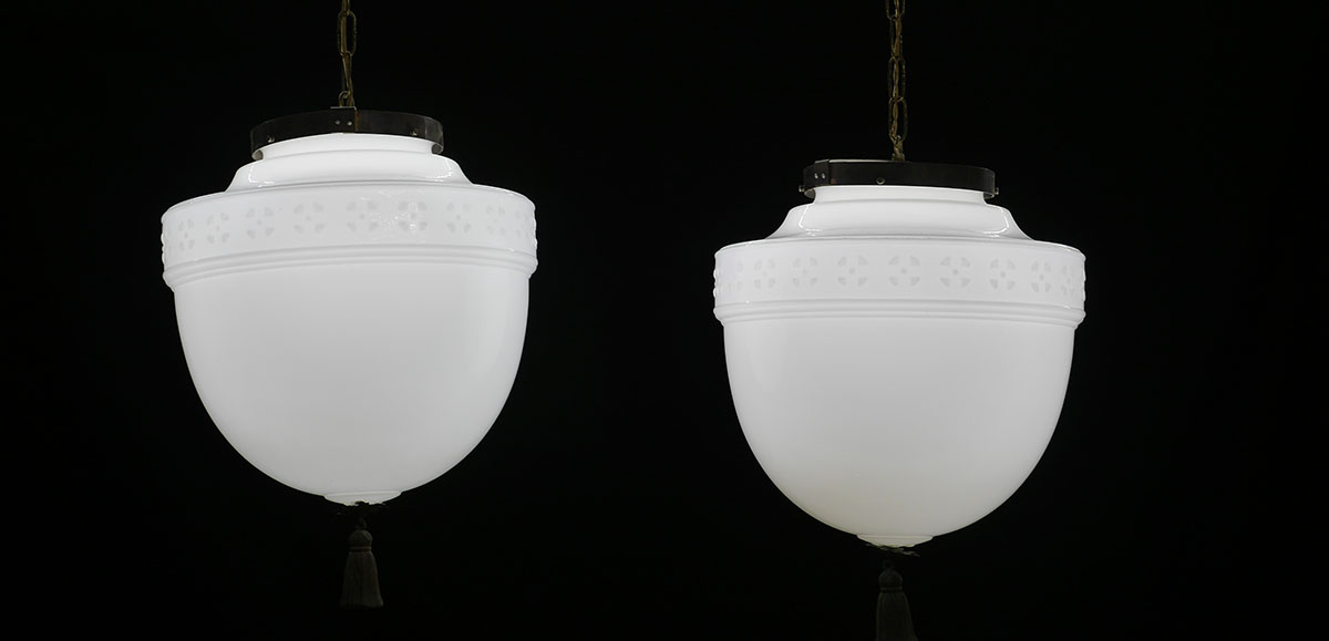 Appraisal: PAIR OF MILK GLASS HANGING LIGHT FIXTURES Reputedly from the