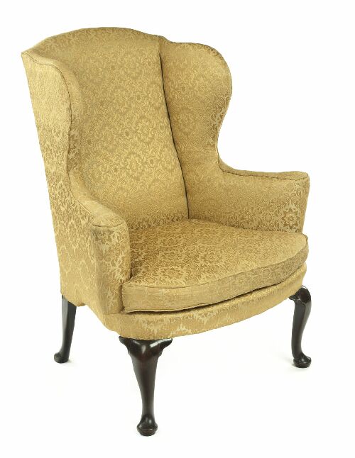 Appraisal: A George I upholstered and mahogany wing armchair the arched