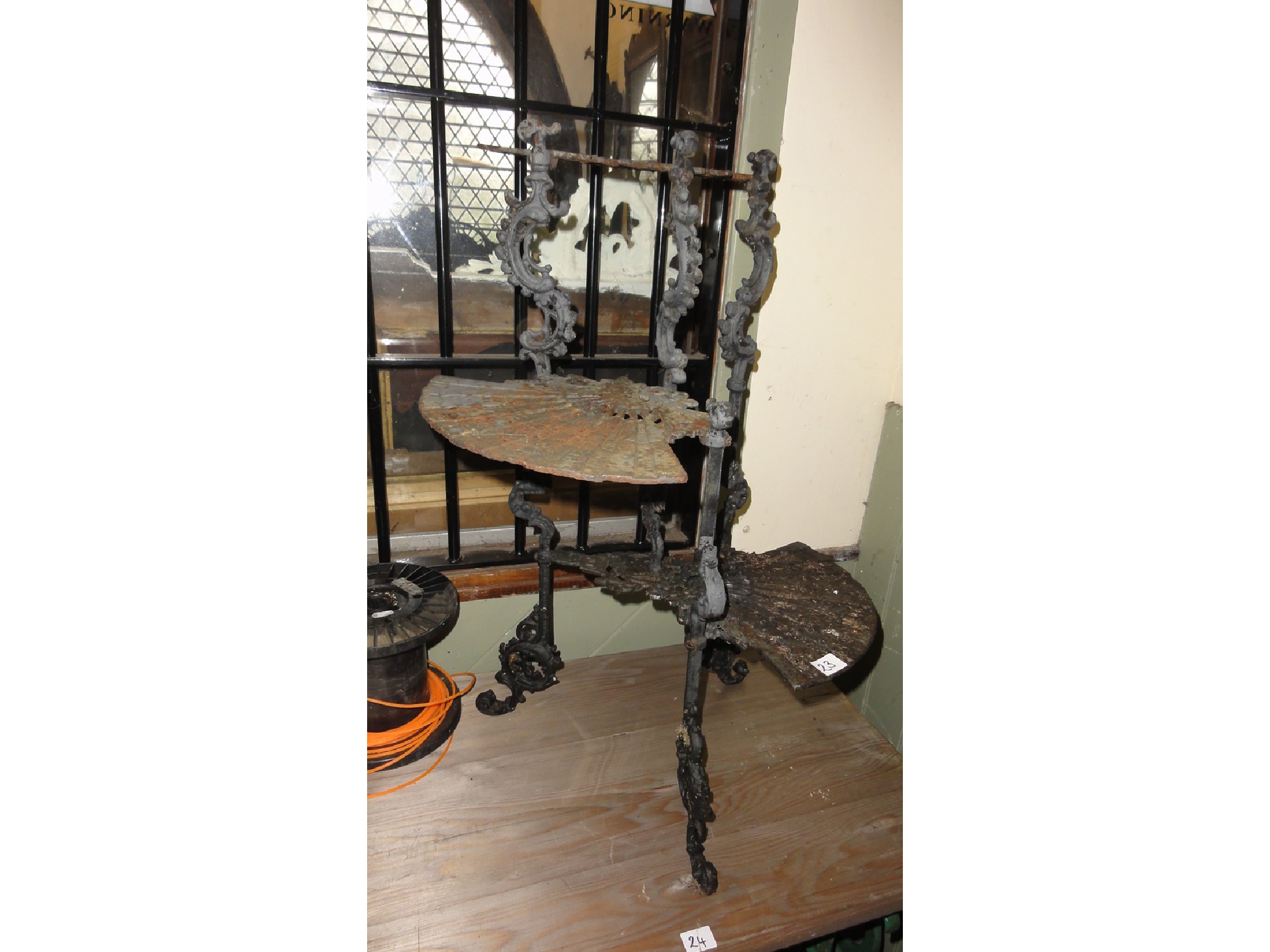 Appraisal: A floorstanding cast iron conservatory stand with three decorative fan