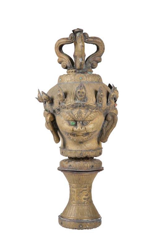 Appraisal: THREE-FACED FINIAL Asian th century sheet brass Three crowned demon