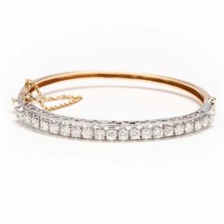 Appraisal: KT Two Color Gold Diamond Bangle Bracelet of hinged and