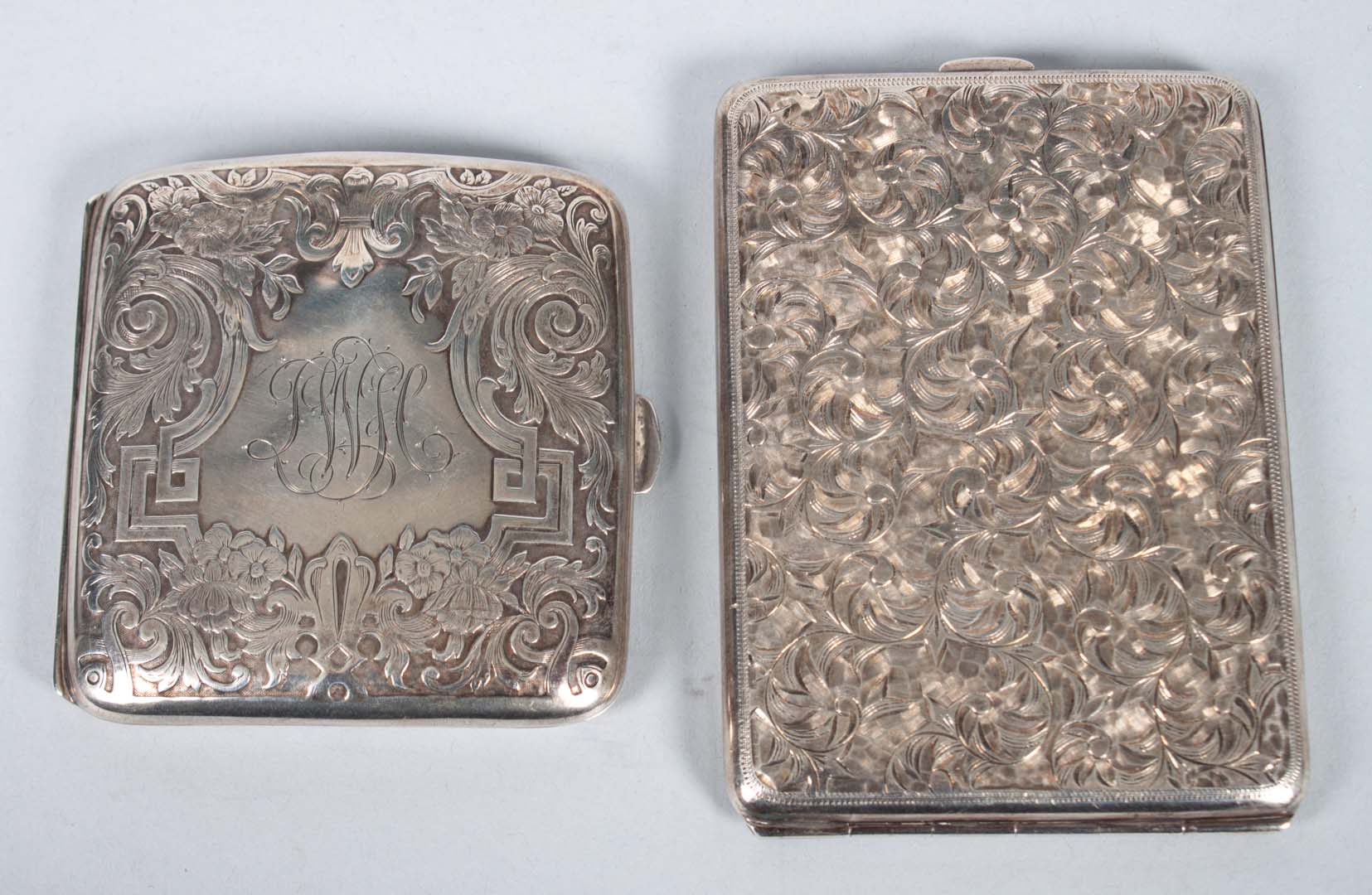 Appraisal: Two engraved sterling silver cigarette cases no makers one marked