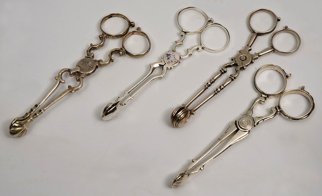 Appraisal: A GROUP OF FOUR GEORGE III SILVER SUGAR NIPS one