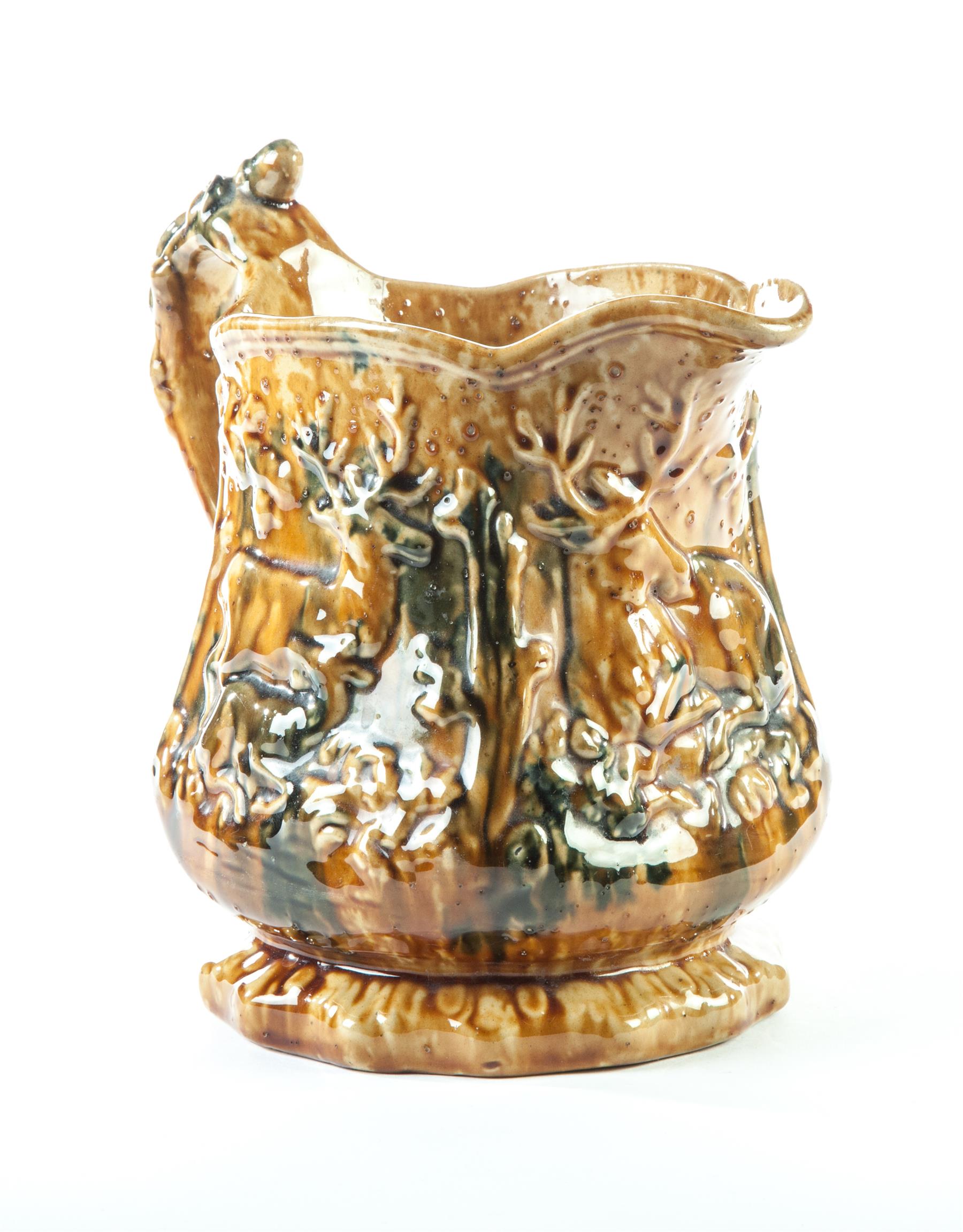 Appraisal: OHIO BROWN AND BLUE-GLAZED STAG AND DOE PITCHER East Liverpool