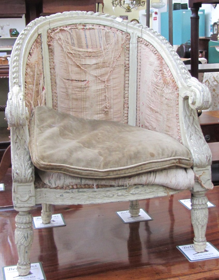 Appraisal: A child's green painted tub back armchair with bow seat