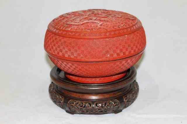 Appraisal: A CHINESE CINNABAR LACQUER BOWL and cover carved with pine