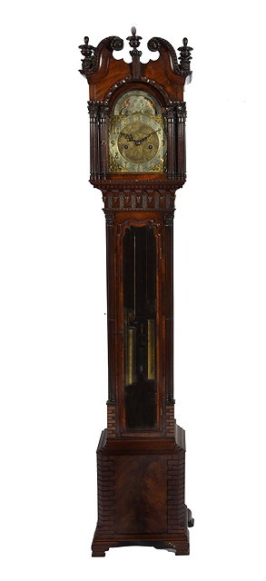 Appraisal: A CHIPPENDALE STYLE MAHOGANY GRANDMOTHER CLOCK having an arched brass