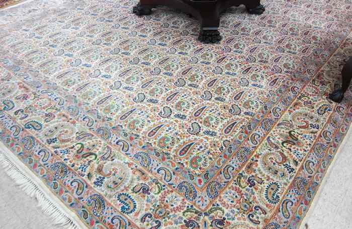 Appraisal: PERSIAN CARPET hand knotted in an overall flower and boteh