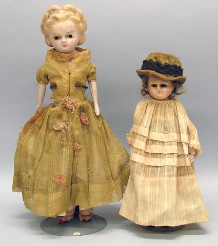 Appraisal: Pair of wax over papier mache shoulder head dolls Doll