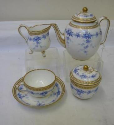 Appraisal: A ROYAL WORCESTER PORCELAIN TEA FOR ONE comprising teapot cup