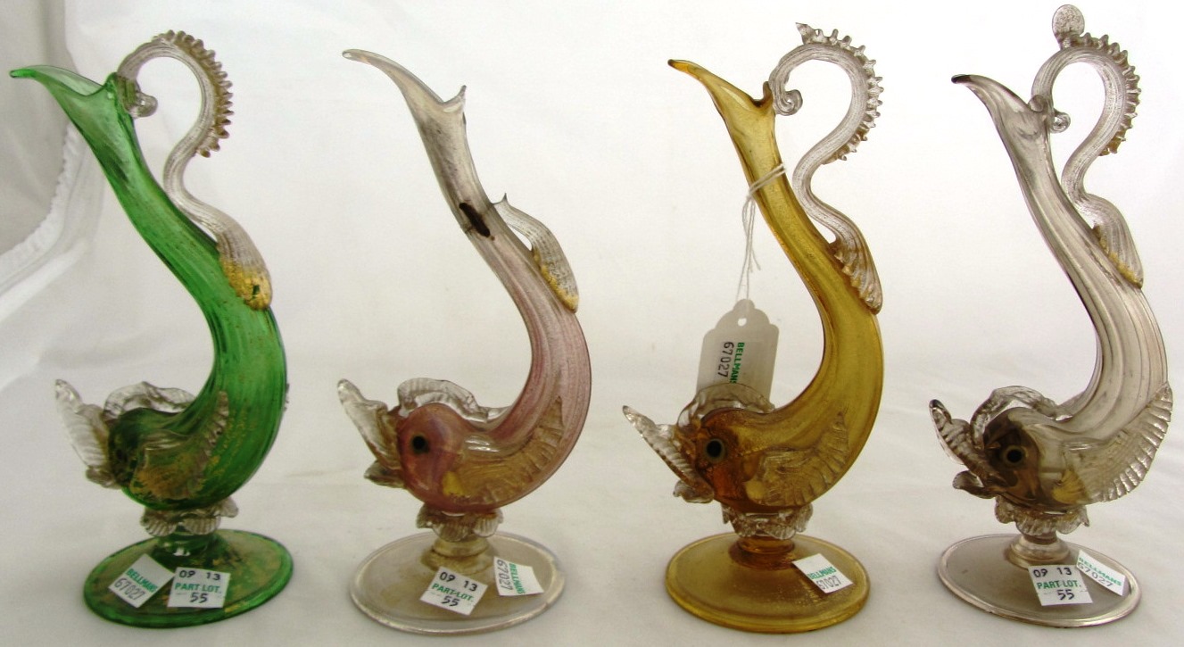 Appraisal: Four Italian glass ewers th century each moulded as a