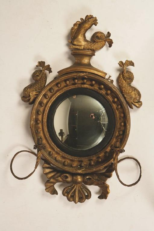 Appraisal: A REGENCY GILTWOOD CONVEX WALL MIRROR the circular plate within