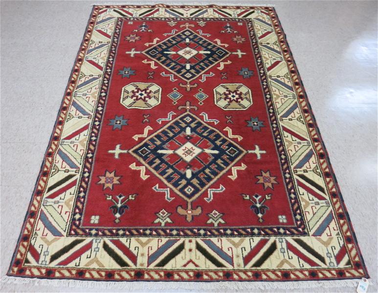 Appraisal: HAND KNOTTED ORIENTAL AREA RUG Indo-Kazak double geometric medallion design