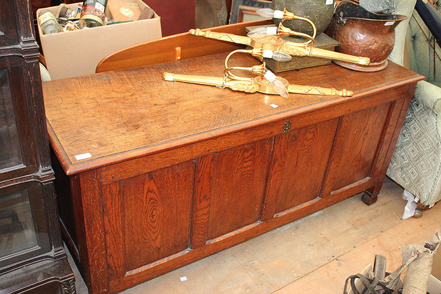 Appraisal: AN OLD OAK COFFER with quadruple panelled front and standing