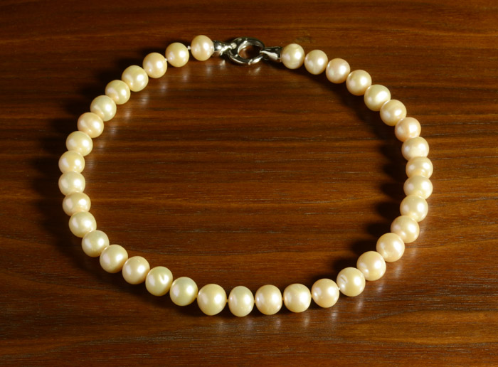 Appraisal: PRINCESS LENGTH PINK PEARL NECKLACE strung with well matched off-round