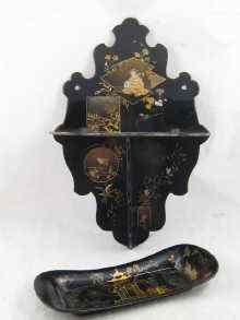 Appraisal: An oriental folding wall bracket in black lacquer with gilt