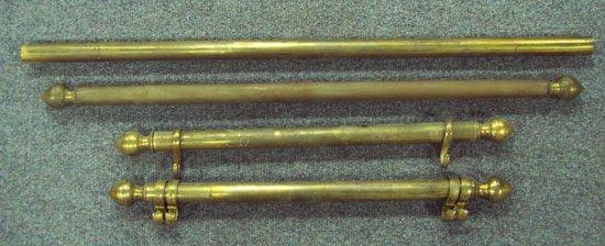 Appraisal: A pair of brass picture rails with supports cm wide