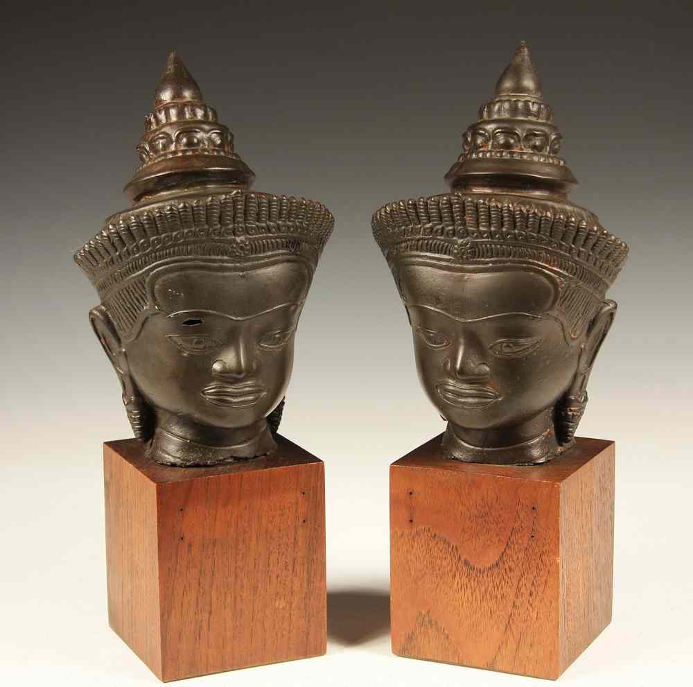 Appraisal: PAIR ASIAN BRONZE HEADS - Pair of Hollowcast Colonial Khmer