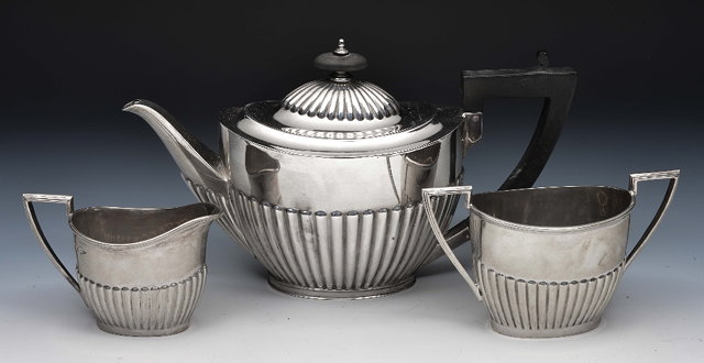 Appraisal: Three piece silver tea setof tapering form with reeded borders