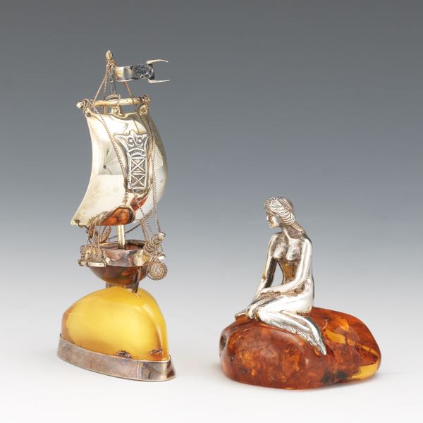 Appraisal: TWO DANISH STERLING SILVER AND AMBER CABINET SCULPTURES LITTLE MERMAID