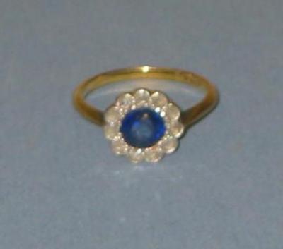 Appraisal: A VICTORIAN SAPPHIRE AND DIAMOND CLUSTER RING the central round