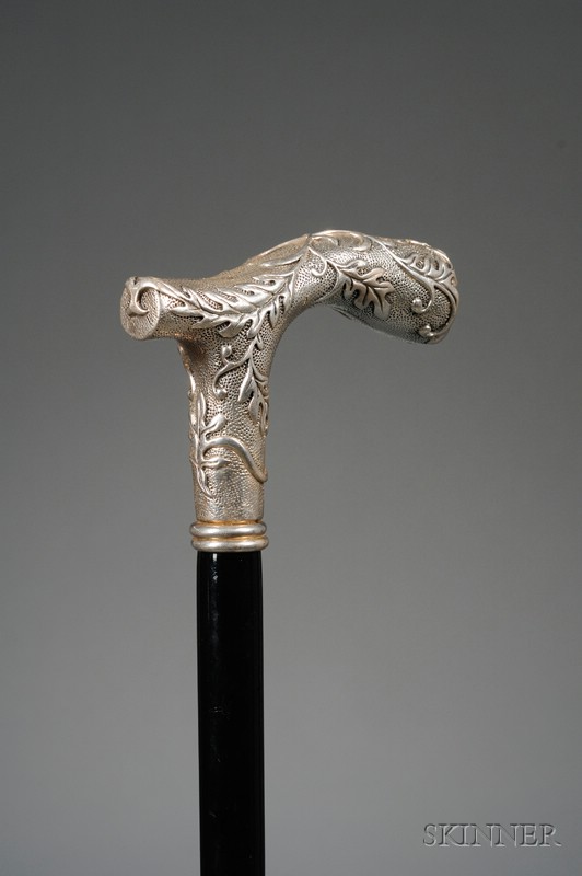 Appraisal: Silver-handled Cane with Foliage Design Headpiece and Ebonized Wood lg