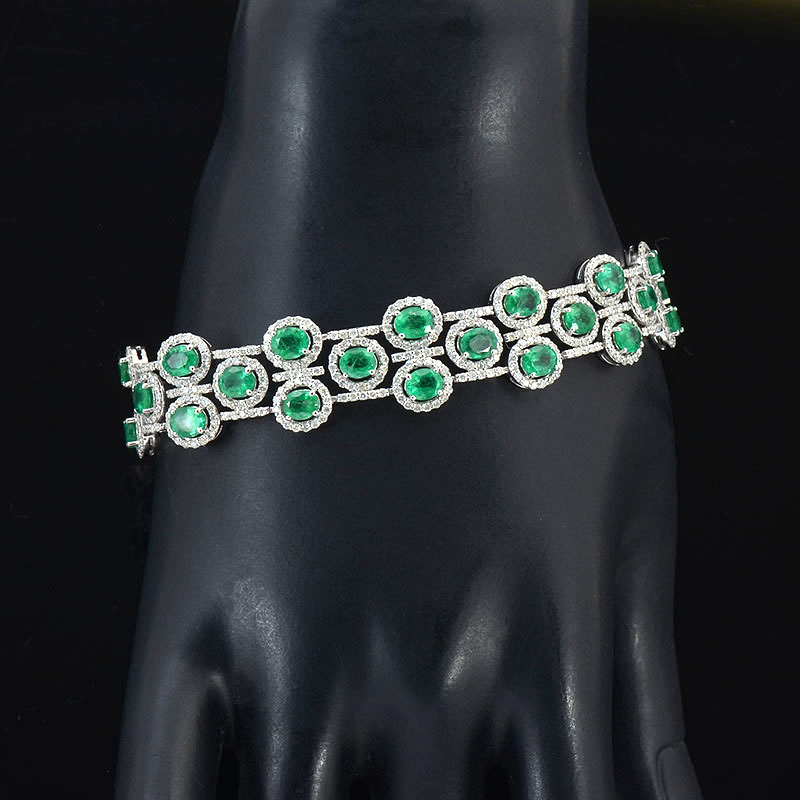 Appraisal: CTW EMERALD DIAMOND BRACELET IN PLATINUM prong set oval mixed